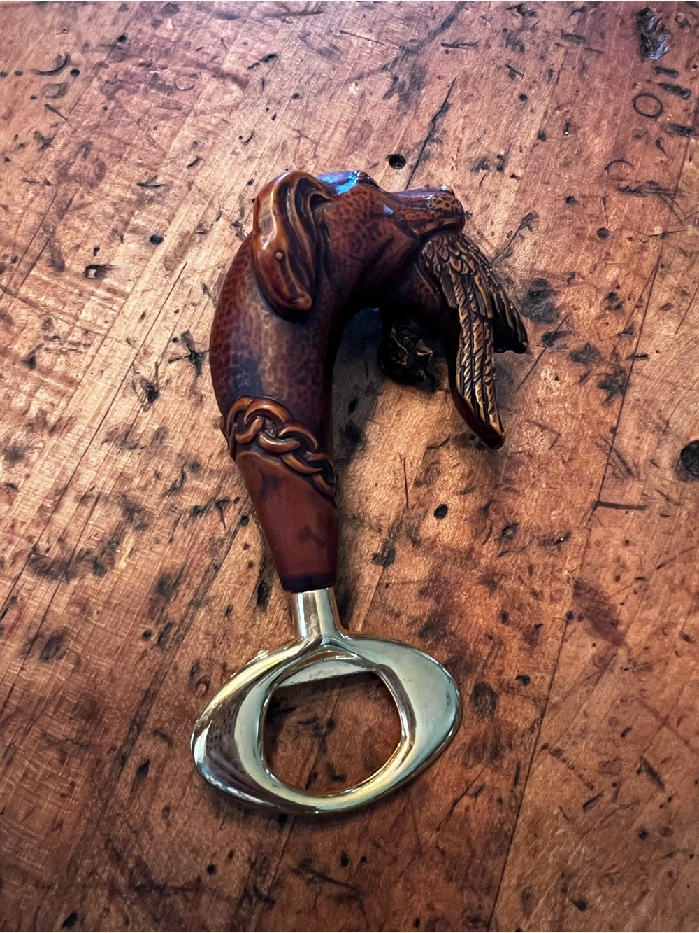 Brown Carved Dog-Head Bottle Opener with Brass Finish
